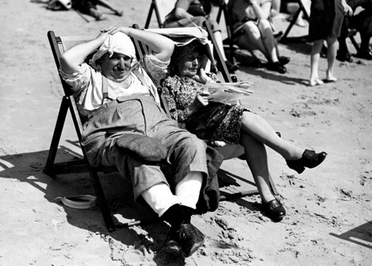 Couple sitting in deck chairs Couple sitting in deck chairs
