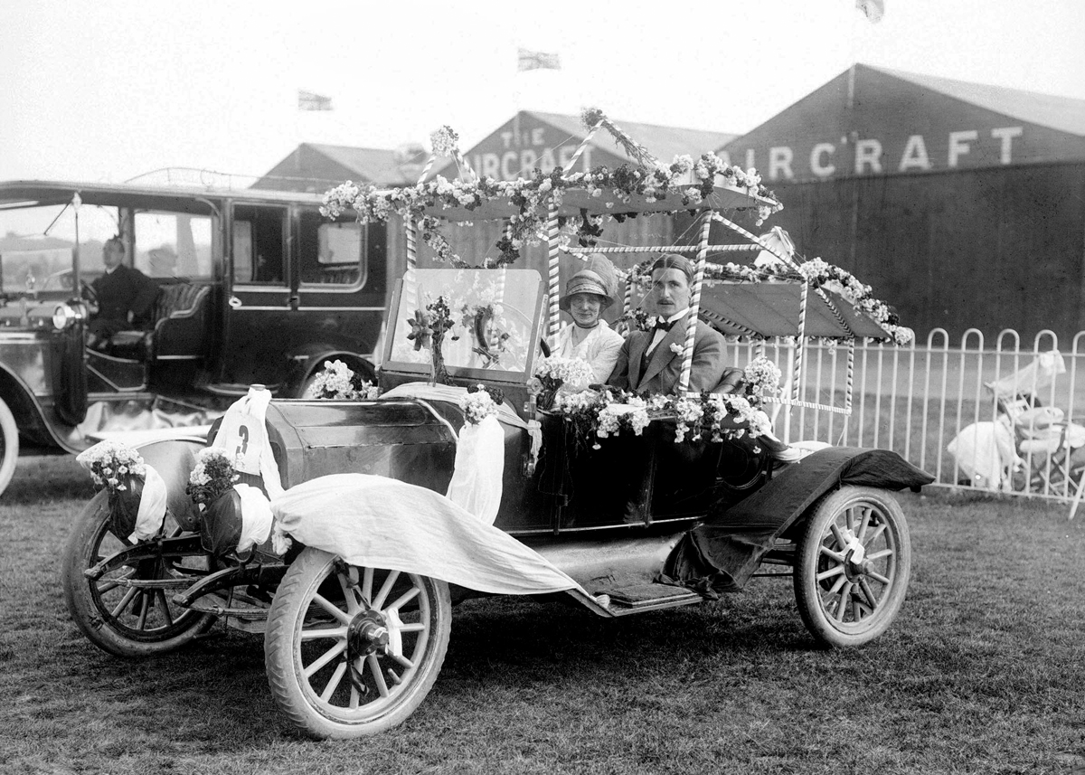 Couple in car with flowers Couple in car with flowers