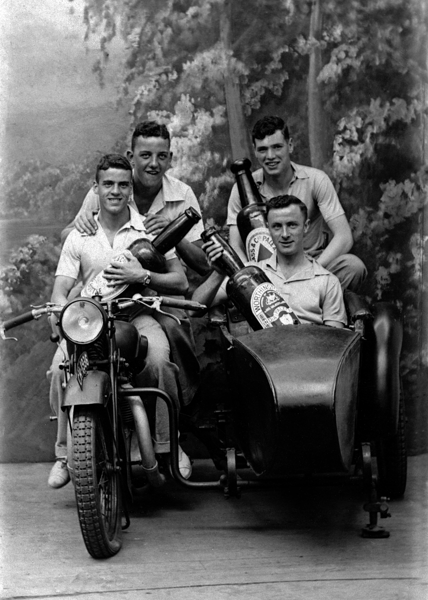 Four lads with their beers Four lads with their beers
