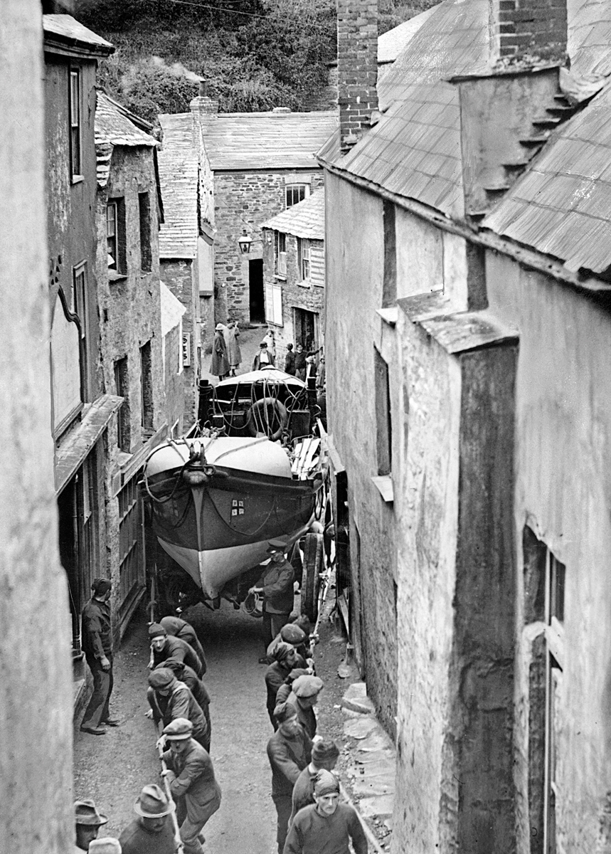Boat being hauled through narrow street Boat being hauled through narrow street